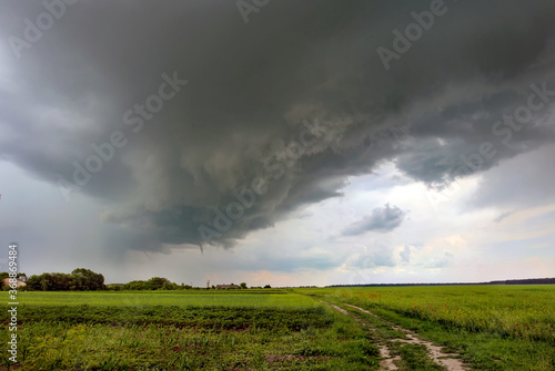 Tornado atmospheric whirlwind in a cumulonimbus thundercloud