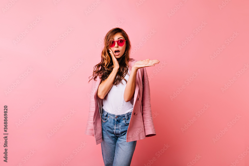 Surprised european woman with shiny ginger hair standing in studio. Appealing caucasian girl expressing amazement. Surprised european woman with shiny ginger hair standing in studio. Appealing caucasian girl expressing amazement.