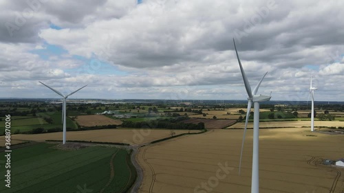 Flying through a wind turbine farm in the UK countryside_Ungraded photo