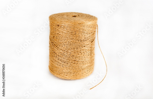 Hank of a hemp rope. Textile reel on isolated white background.