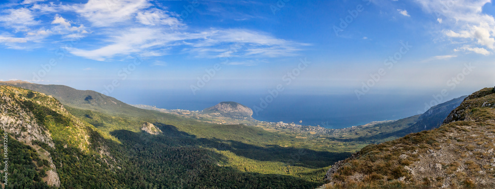 Panoramic landscape. View of the Yalta mountain-forest nature reserve, resort settlement Gurzuf. Mount Ayu-Dag 570 m high issued into the sea. Republic of Crimea.