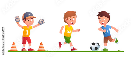 Boys playing soccer game together, kicking ball