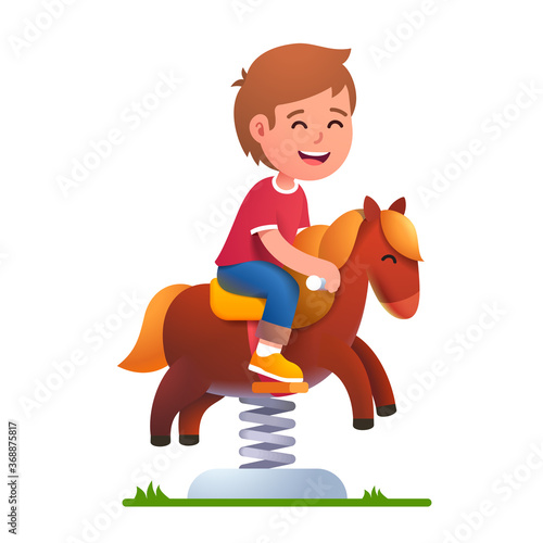 Preschool kid play riding rocking horse on spring