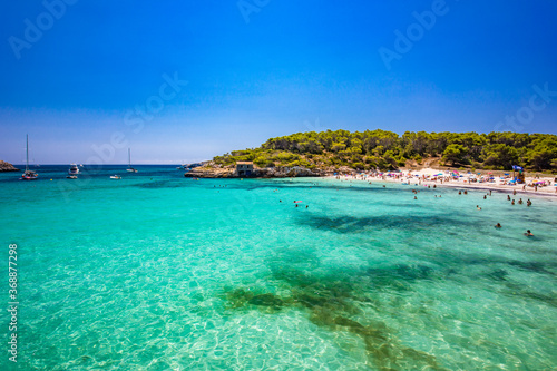 Fototapeta Naklejka Na Ścianę i Meble -  CALA MONDRAGO, Majorka, Spain, 24 July 2020 - People enjoy the beach in summer, Parque Natural de Mondrago. Santanyi. Malorca. Spain