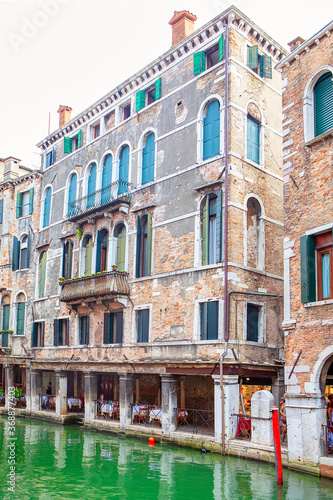 Terrace Overlooking the Water Canal in Venice . Old Architecture of Venezia 