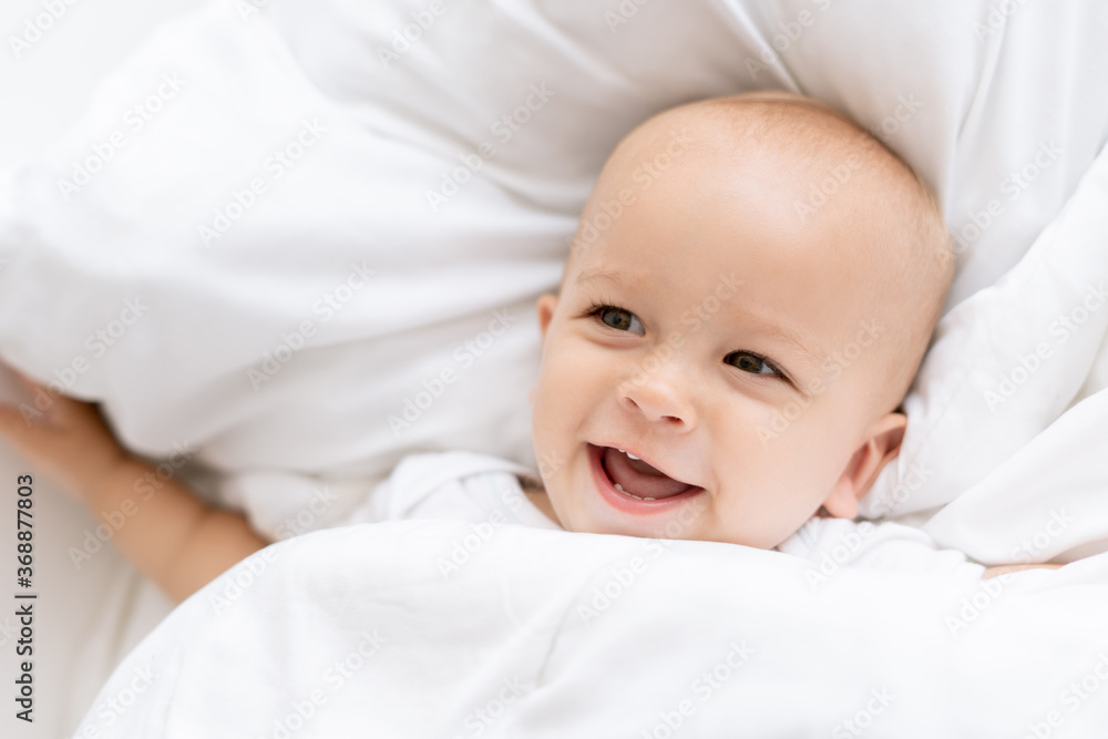 happy baby boy on bed happy baby boy on bed