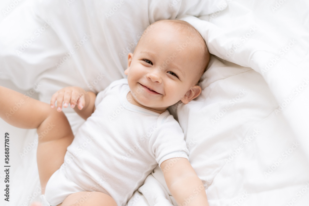 happy little boy on bed happy little boy on bed