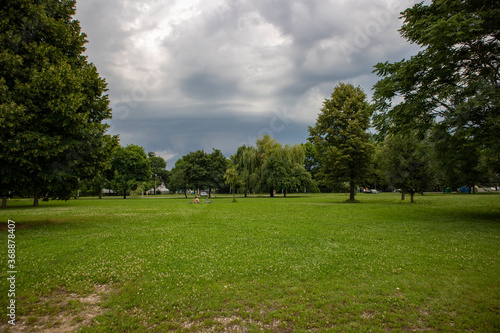 Rain and hail clouds gathering over zagreb city, fast approaching over the shore of Jarun lake, popular spot for relaxation, sports and casual recreation in the green environment