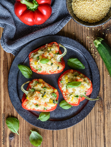 Bell peppers stuffed with bulgur, vegetable and cheese