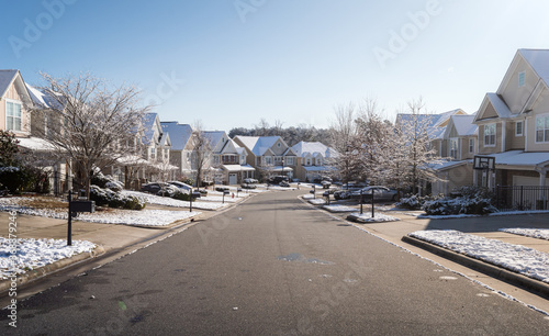 Street covered with snow on a winter sunny day