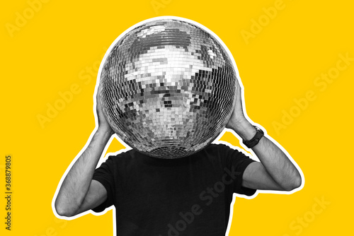 Man and a mirror ball instead of a head on a bright yellow background. The concept of modern design, creativity and style. Flyer for advertising.