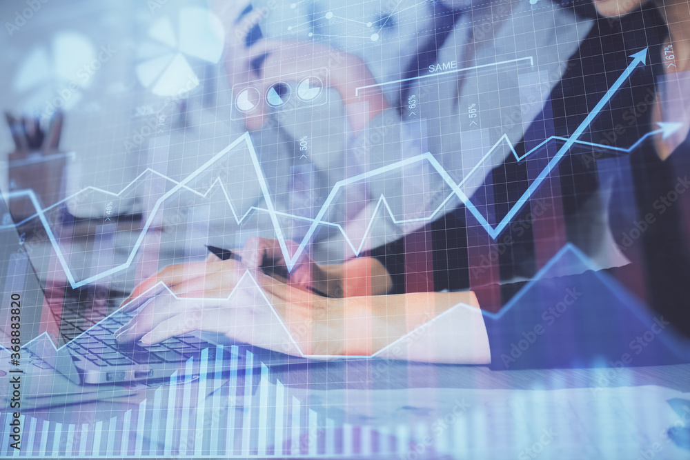 Multi exposure of woman hands typing on computer and financial graph hologram drawing. Stock market analysis concept. Multi exposure of woman hands typing on computer and financial graph hologram drawing. Stock market analysis concept.