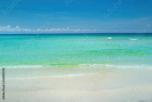 Fototapeta Naklejka Na Ścianę i Meble -  Sand beach with blue ocean and cloudscape background.