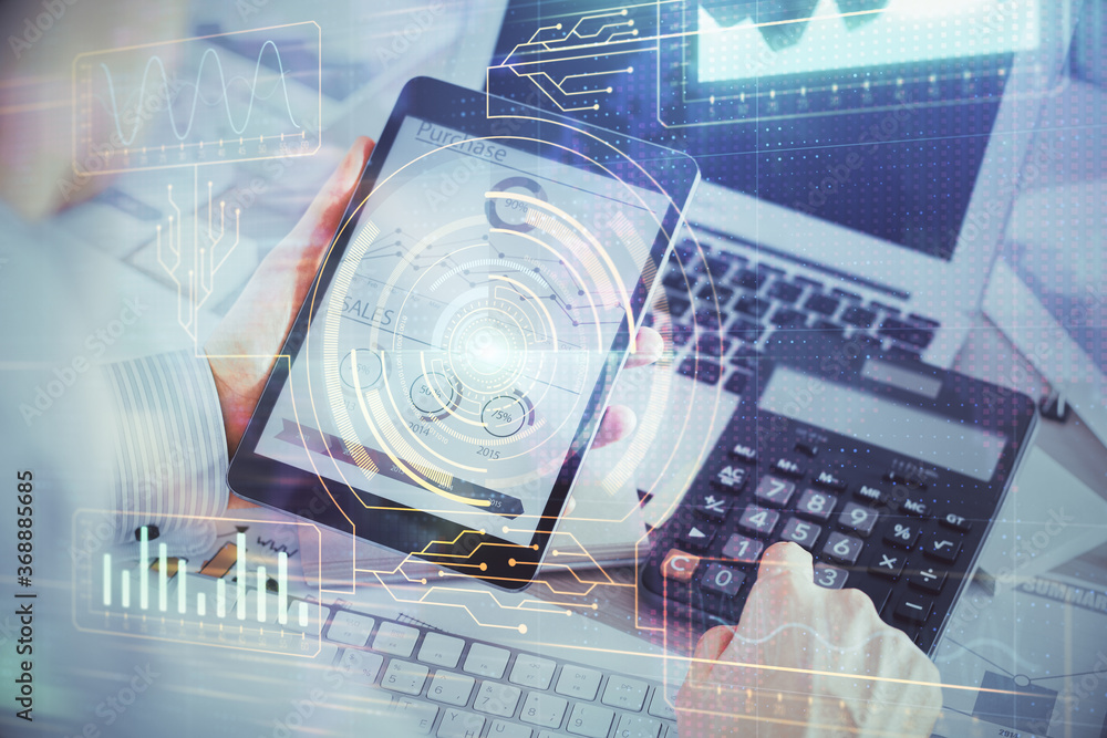 Double exposure of man's hand holding and using a digital device and data theme hologram drawing. Technology concept. Double exposure of man's hand holding and using a digital device and data theme hologram drawing. Technology concept.