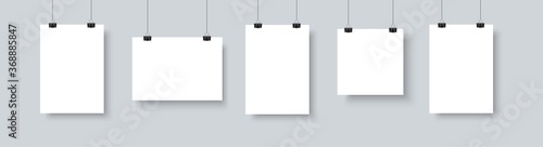 Paper paper poster mockup on grey gallery wall. Empty A4 sized vector paper frame mockup hanging with paper clip