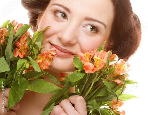 woman fith bright pink-yellow flowers photo