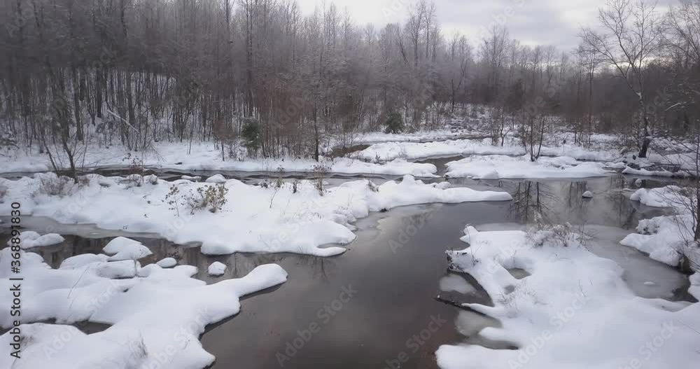 Flying over snowy creek Flying over snowy creek