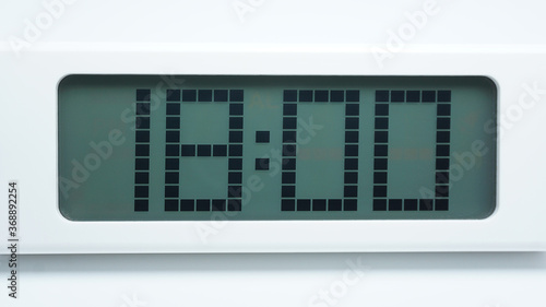 Digital alarm clock on White background waking beginning of time 18.00 am or pm, Time concept..