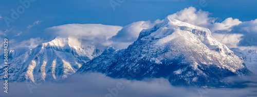 powerful panoramic scene of snow covered mountains above Lake McDonald, Glacier National Park, Montana © Robert Paulus