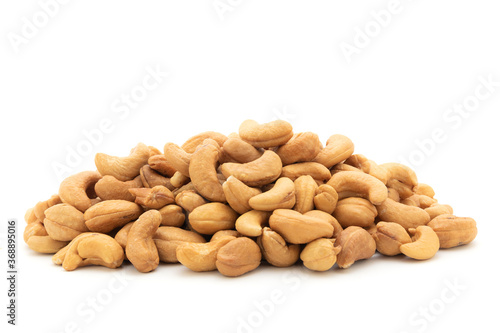 plie of roasted cashew nut on white background