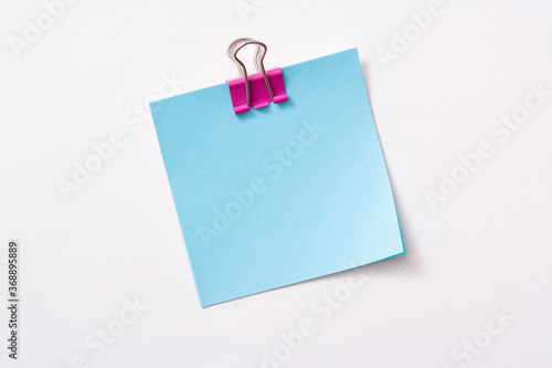 note paper and clip isolated on white background 