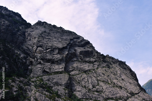 Panorama of rocks covered with trees. Caucasus, North Ossetia.