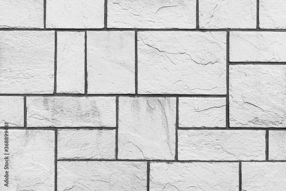 Fototapeta premium Block pattern of white stone cladding wall tile texture and seamless background