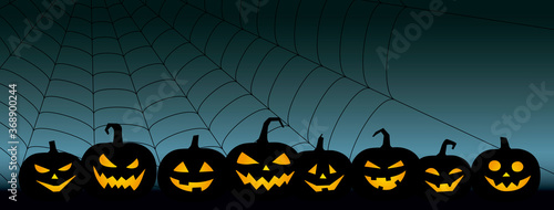 ハロウィーン、ジャック・オー・ランタンとクモの巣の不気味な背景