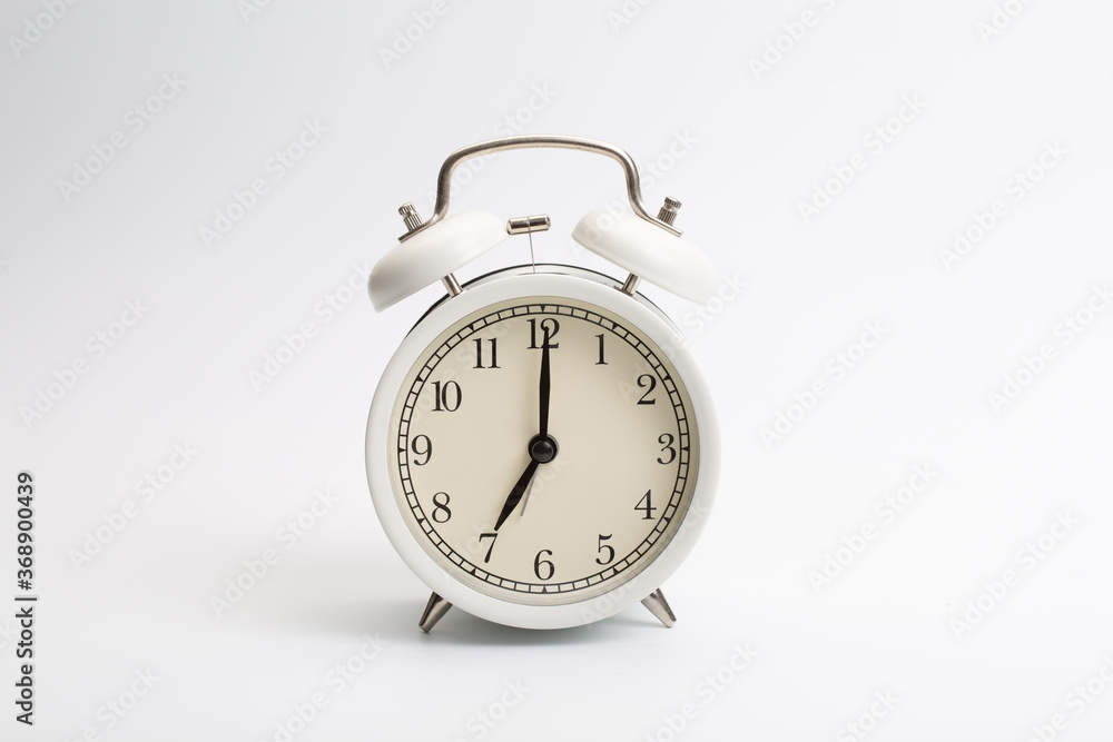 Alarm clock worker on white background