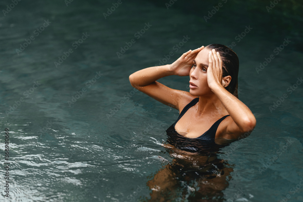 Retreat and vacation. Beautiful young woman relaxing in spa swimming pool. Retreat and vacation. Beautiful young woman relaxing in spa swimming pool.