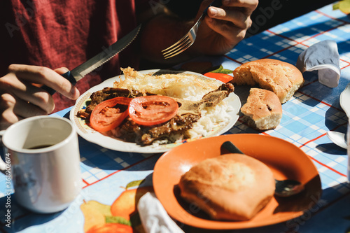 Photos A person has breakfast in a traditional bolivian market from the Yungas region in Bolivia