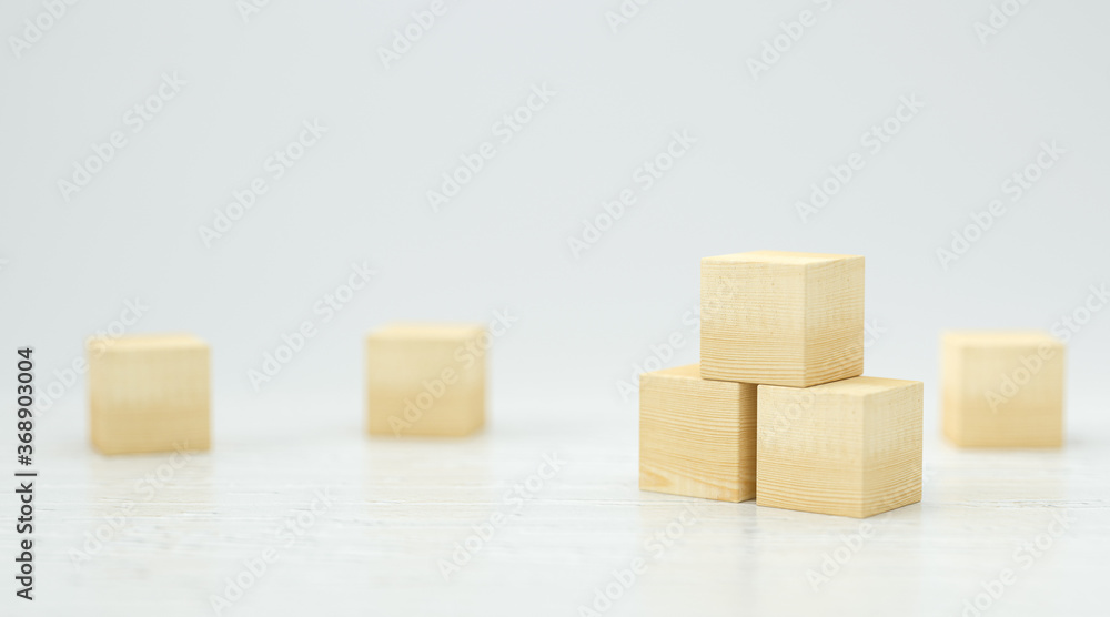 Obraz premium empty wooden cubes for own messages and icons on white background