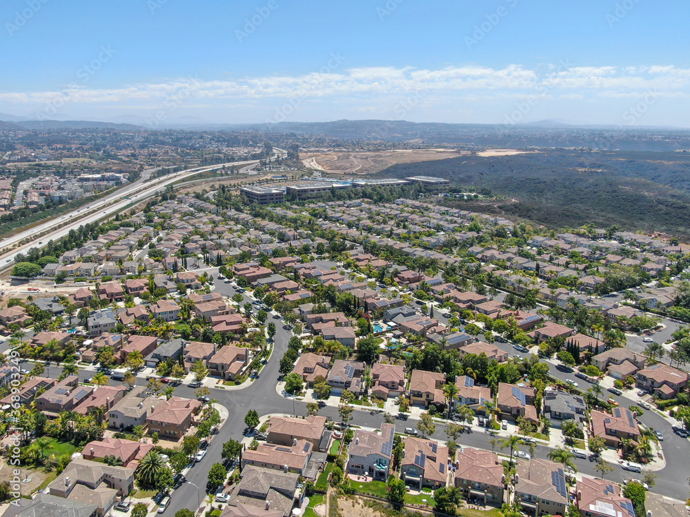 Aerial view of Torrey Santa Fe, middle class subdivision neighborhood with residential villas in San Diego County, California, USA.