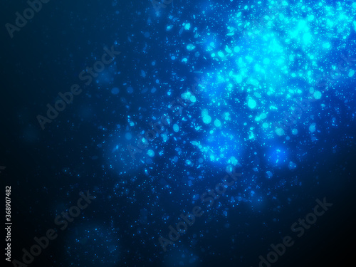Many blue glitter and sparkle light effect floating with spot light from side scene setting on dark blue background