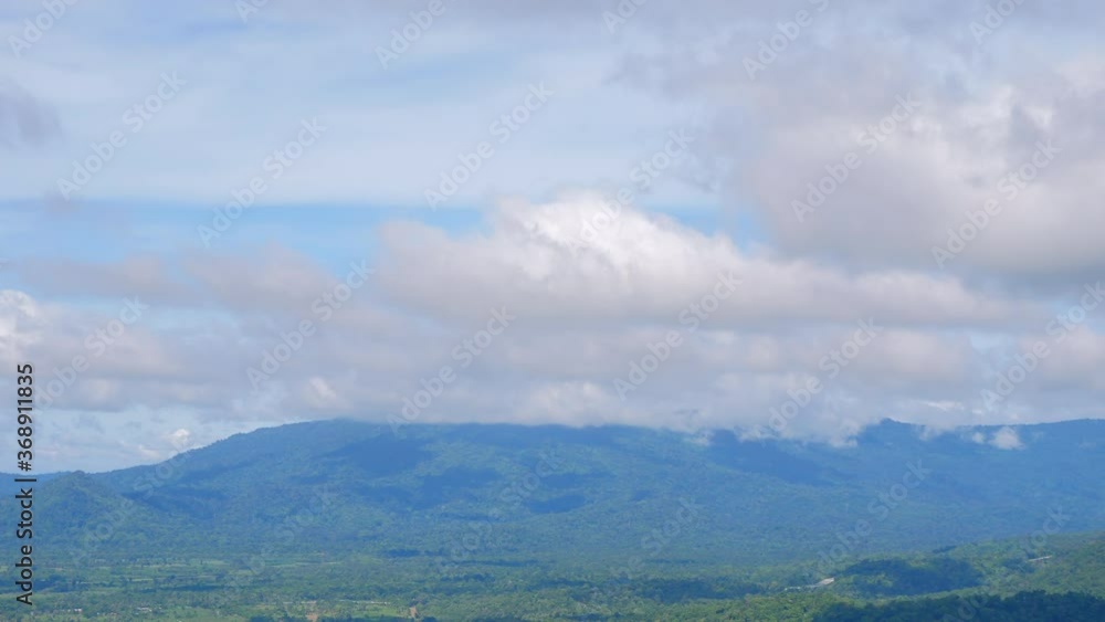 4k Time lapses of the mist floated from the mountains forming a cloud rising into the blue sky 4k Time lapses of the mist floated from the mountains forming a cloud rising into the blue sky