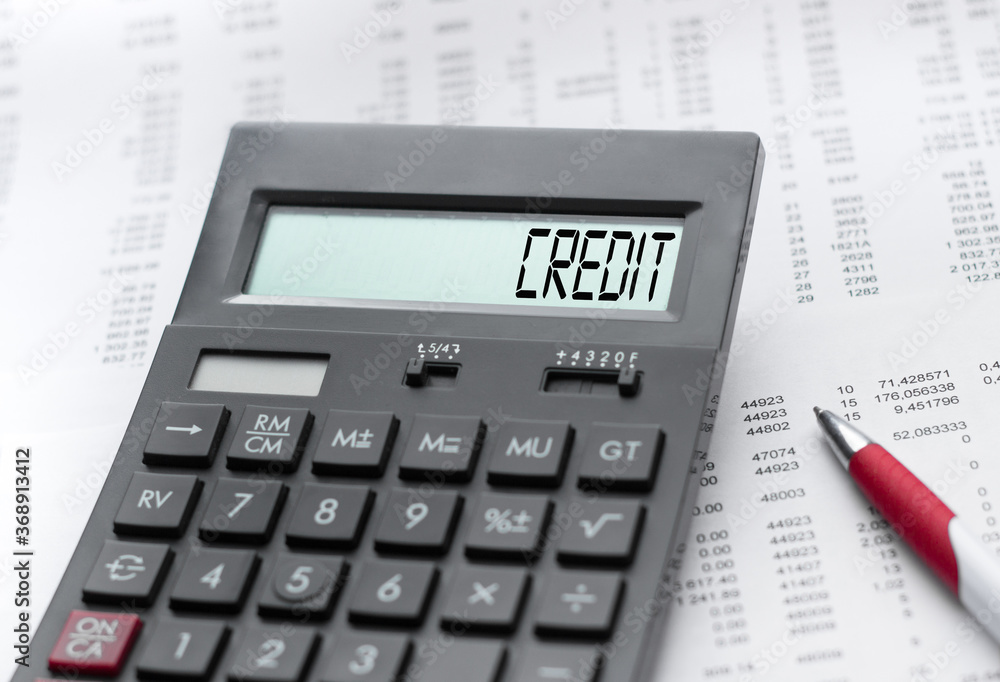 A calculator with the inscription CREDIT . Business profit concept A calculator with the inscription CREDIT . Business profit concept