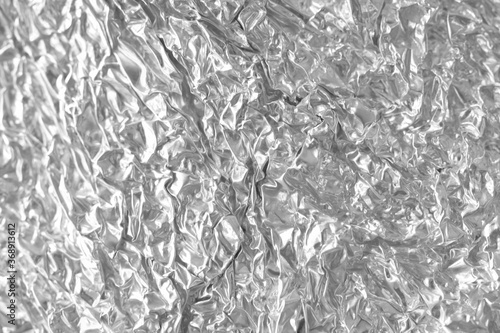 Silver crumpled foil texture and background