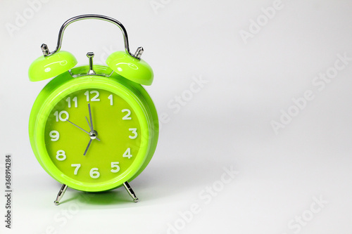 round alarm clock with white background