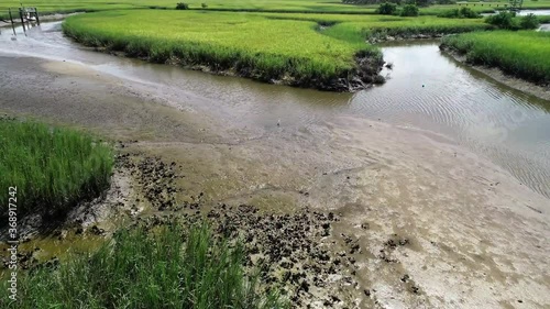 Wallpaper Mural An aerial flyover of a stream creek river leading through a marsh to the Matanzas River in St. Augustine, Florida. Torontodigital.ca