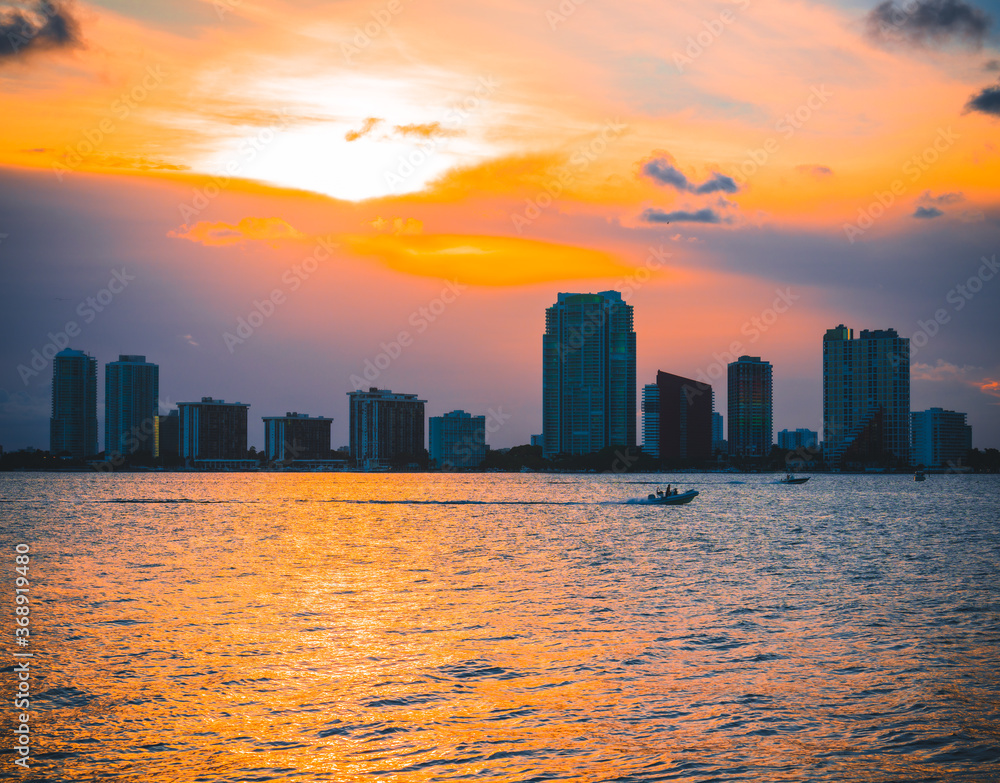 miami skyline at sunset florida sun summer sea boat city downtown sky colors orange 