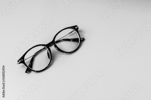  Glasses with transparent optical lenses . Black and white . Copy space .