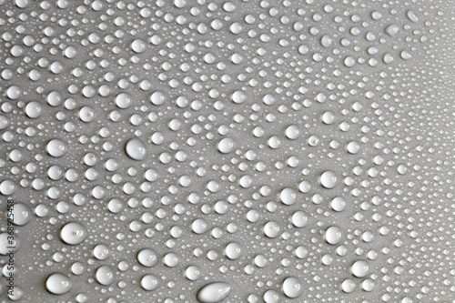 Details of water droplets  moisture condensation  hot water vapor condensation on a neutral background close-up