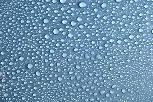Water drops on light background  top view  close-up  macro. Great background with natural water drops and natural light