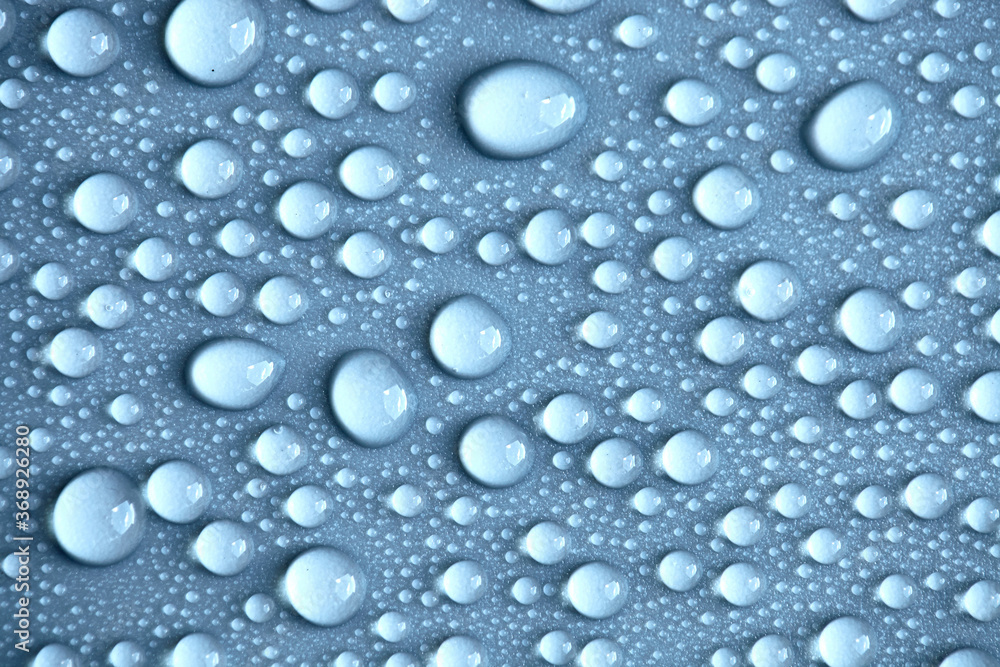 Details of water droplets, moisture condensation, hot water vapor condensation on a neutral background close-up