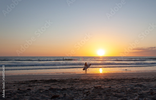 Wide View of Surfer Watching Crashing Waves on Sunset Beach Costa Rica © Drew