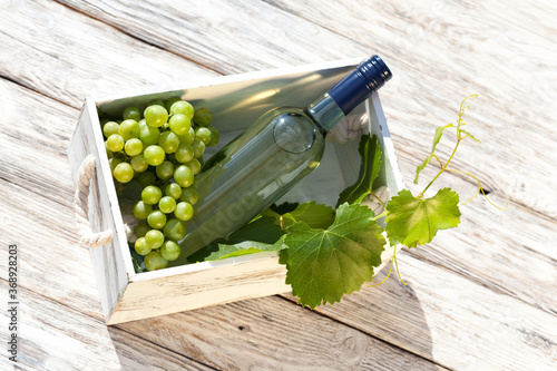 White wine on wooden white vintage table photo