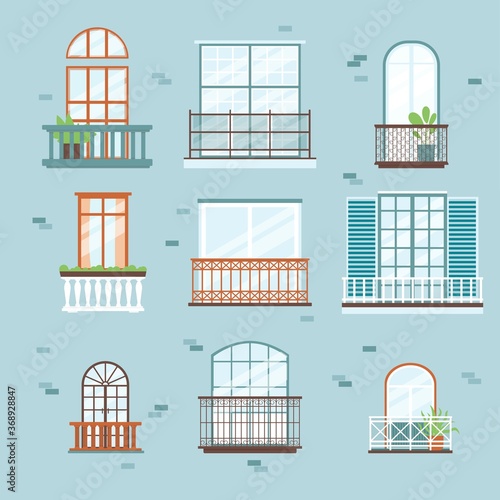 Different windows with balcony on brick building exterior wall.