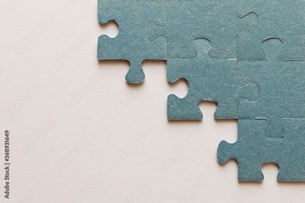 Obraz premium Puzzle. Many puzzle pieces on white background. The concept of collective thinking.