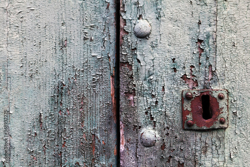 07-12-2015 Monterchi - Arezzo (Italy).A detail of a door stripped and destroyed by the passing of the years photo