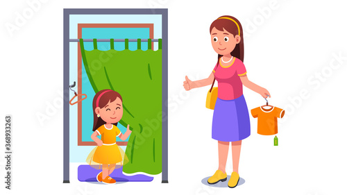 Girl kid trying on dress in shop fitting room